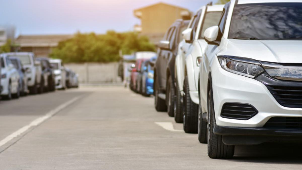 cars_parked_road_10541_812_76587400