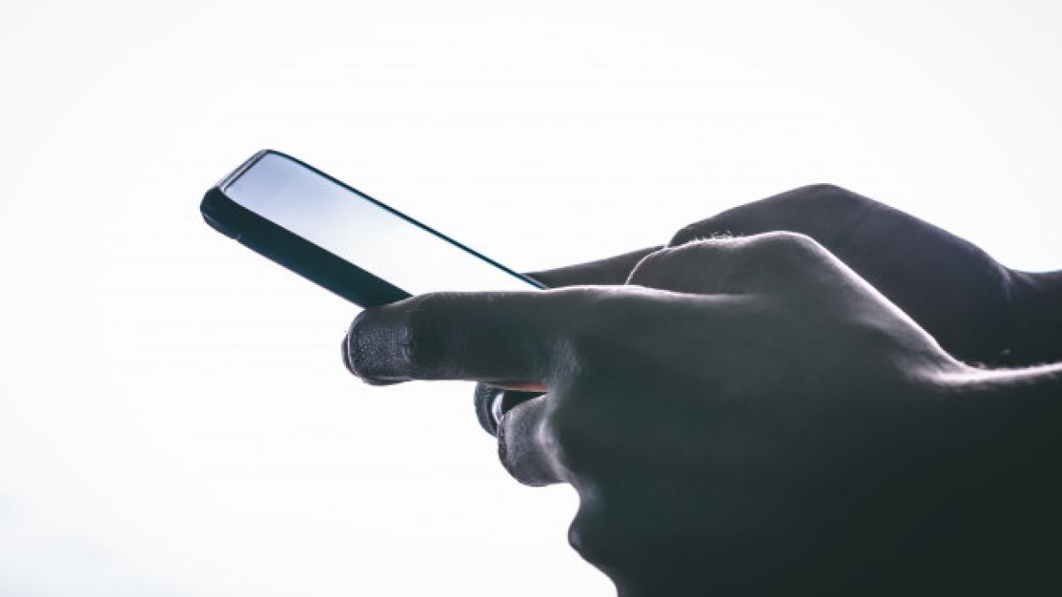 side_view_hands_is_touching_screen_against_white_background_124437_389_97254400