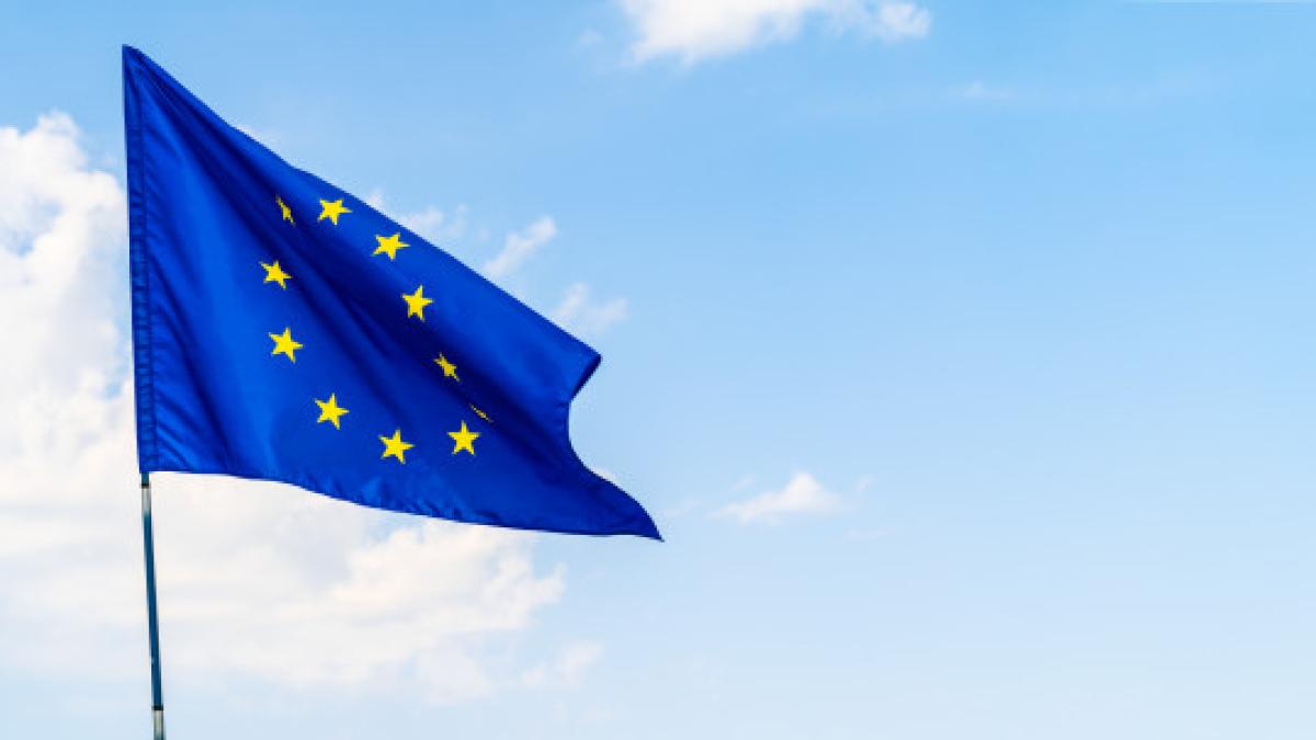 european_union_flag_against_blue_sky_waving_93675_26382_44641800