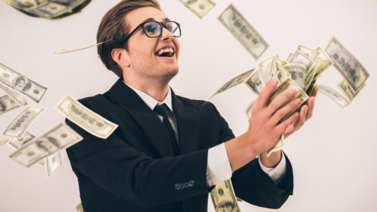 handsome_businessman_suit_glasses_is_catching_cash_85574_6195_23974700