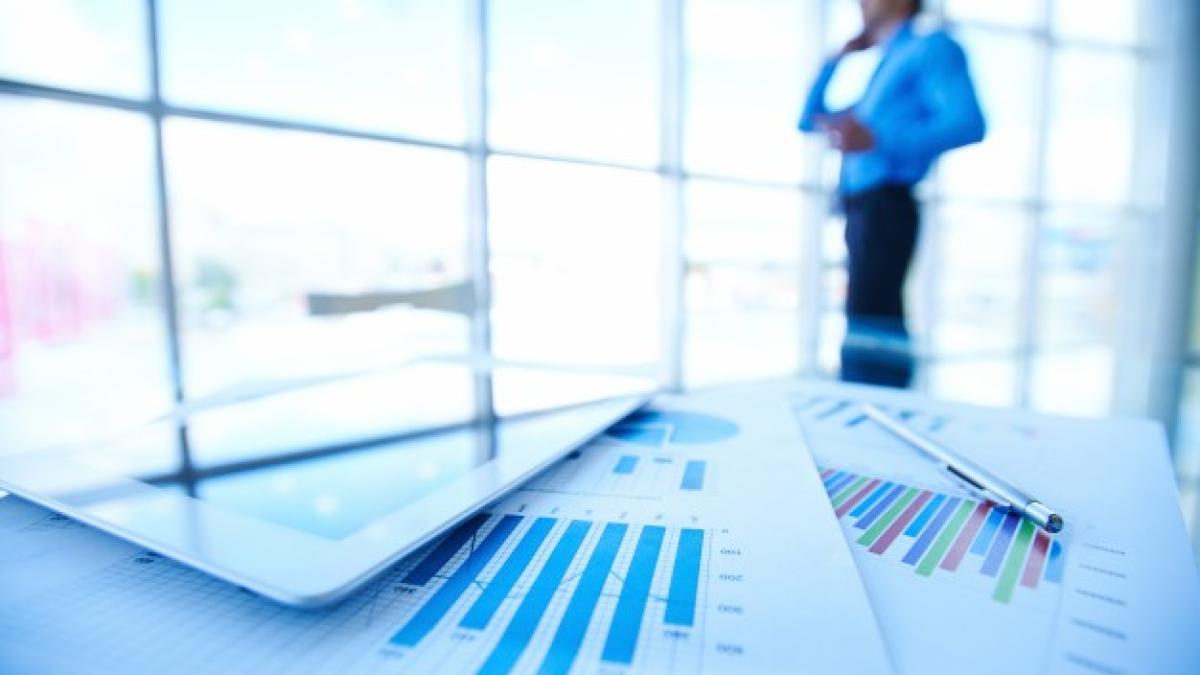 statistic_documents_with_businessman_blurred_background_1098_293_98057400