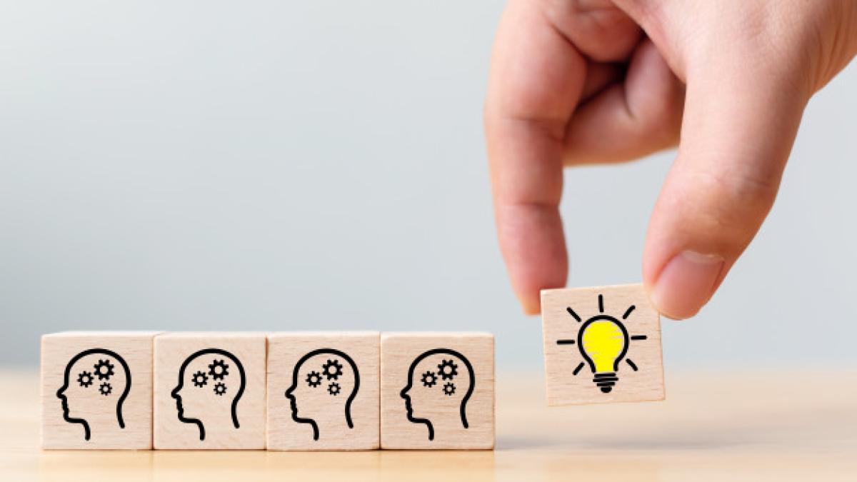 hand_pick_wooden_cube_block_with_head_human_symbol_light_bulb_icon_20693_198_92474500