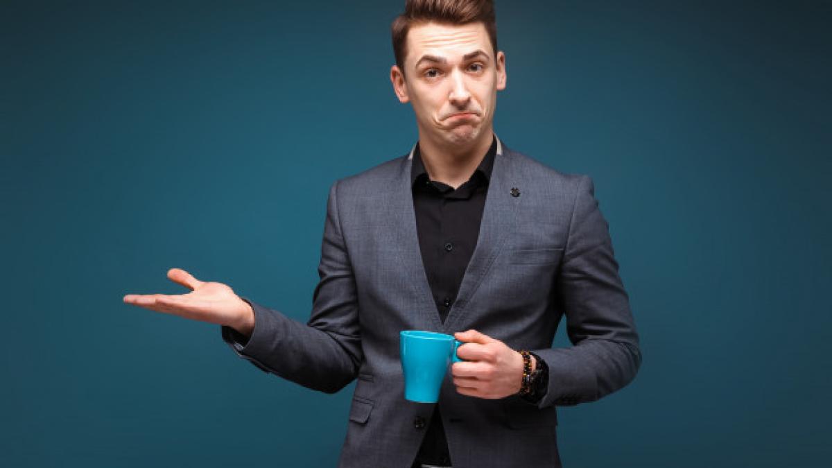 young_attractive_businessman_grey_jacket_black_shirt_hold_blue_cup_88135_6357_92997900