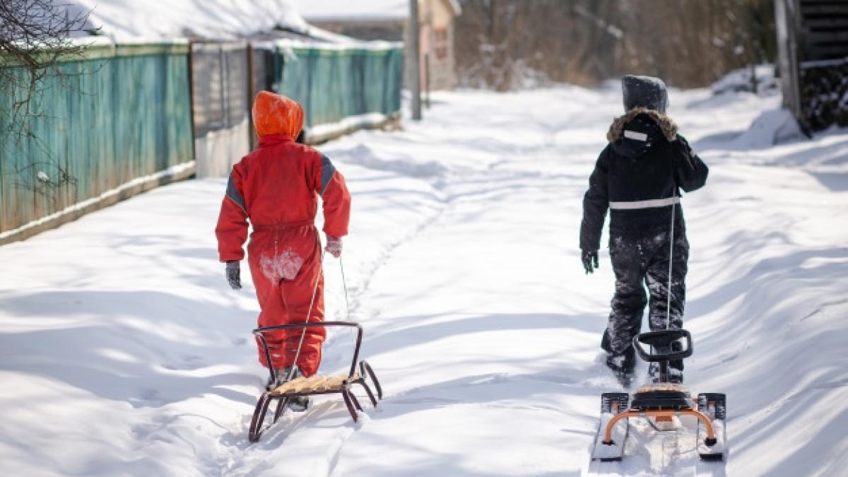 two_boys_walking_snowy_road_village_153527_69_40544100