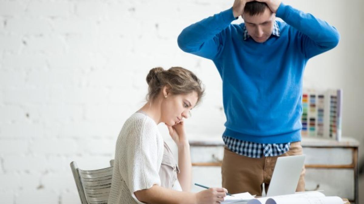 two_colleagues_feeling_troubled_work_1163_1451_97665100