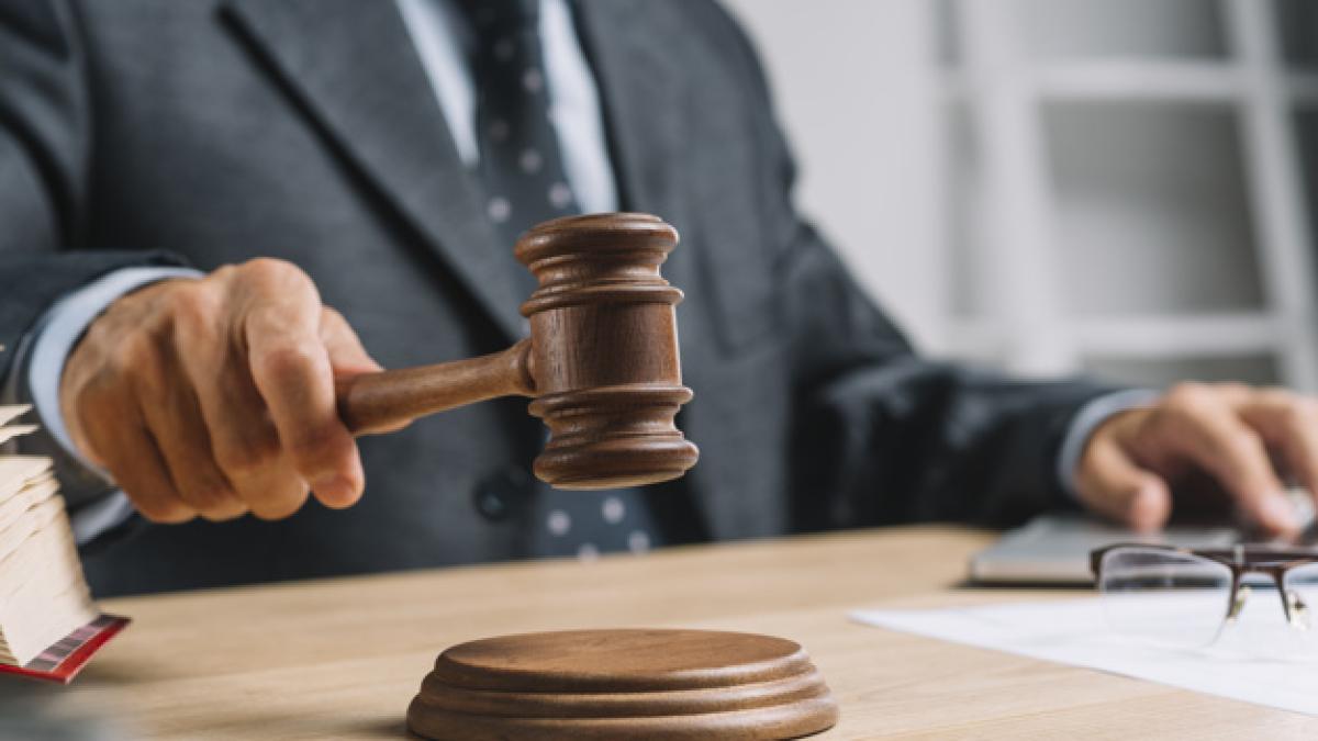 male_judge_lawyer_giving_verdict_by_hitting_mallet_gavel_sounding_block_23_2147898506_97249600