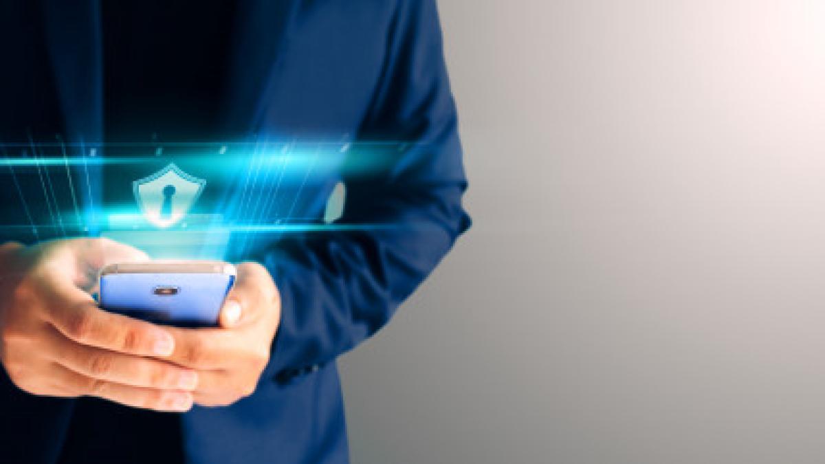 close_up_business_man_formal_blue_suit_use_hold_smart_phone_dark_copy_space_use_finger_print_unlock_smart_phone_security_44282_15_01645900