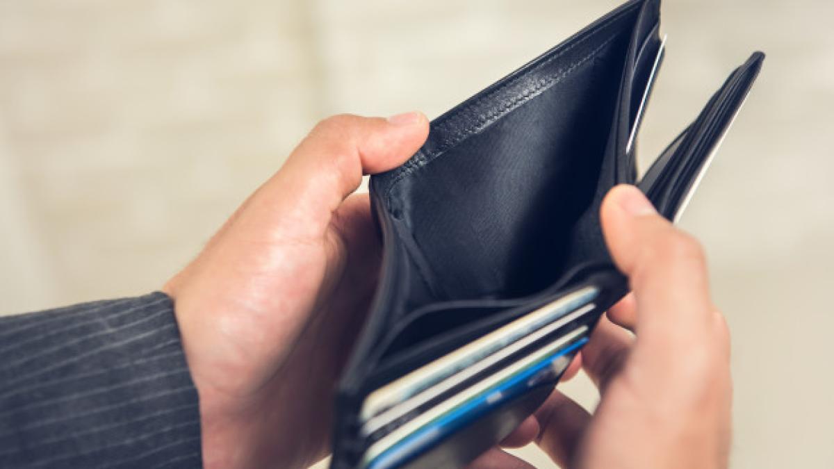 man_hands_showing_empty_wallet_with_no_money_8087_2687_50643200