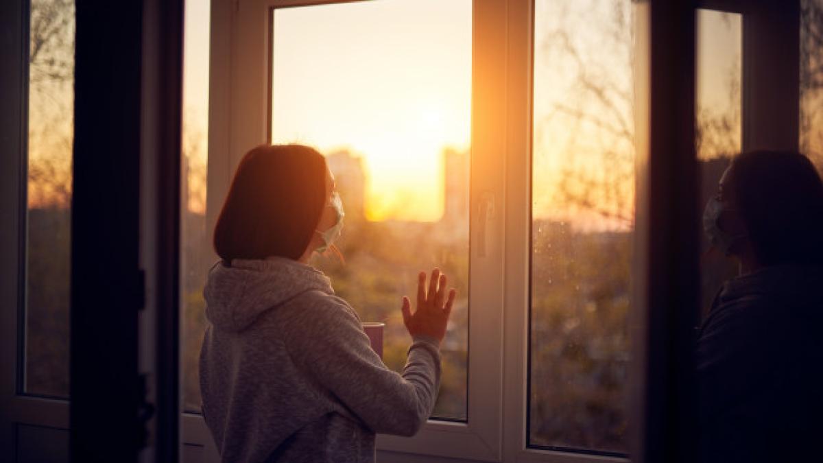 woman_near_window_sunset_isolation_home_virus_outbreak_stay_home_concept_213438_161_91201400