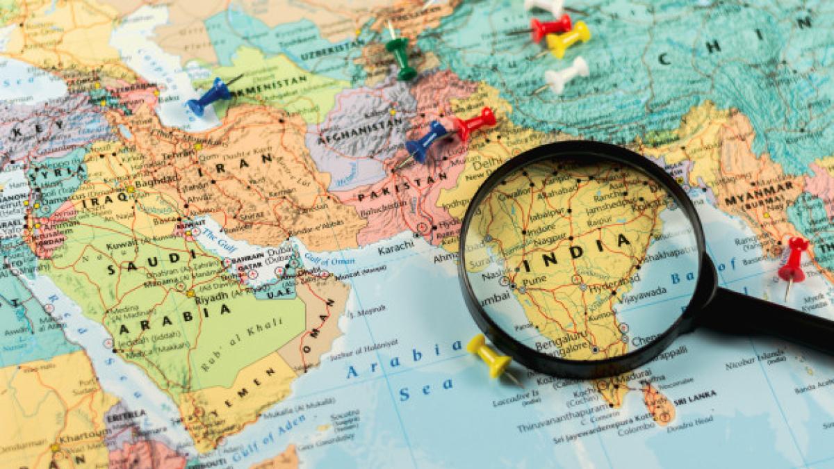 magnifying_glass_world_map_selective_focus_india_economic_business_concept_70287_3312_70667900