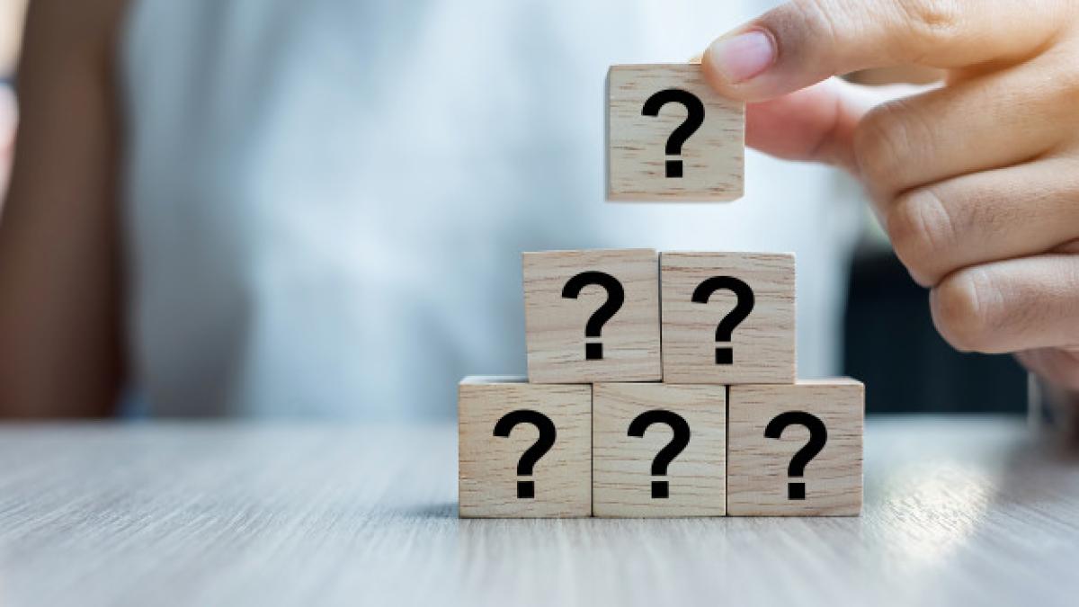 businesswoman_hand_placing_questions_mark_word_with_wooden_cube_42256_1463_79576800