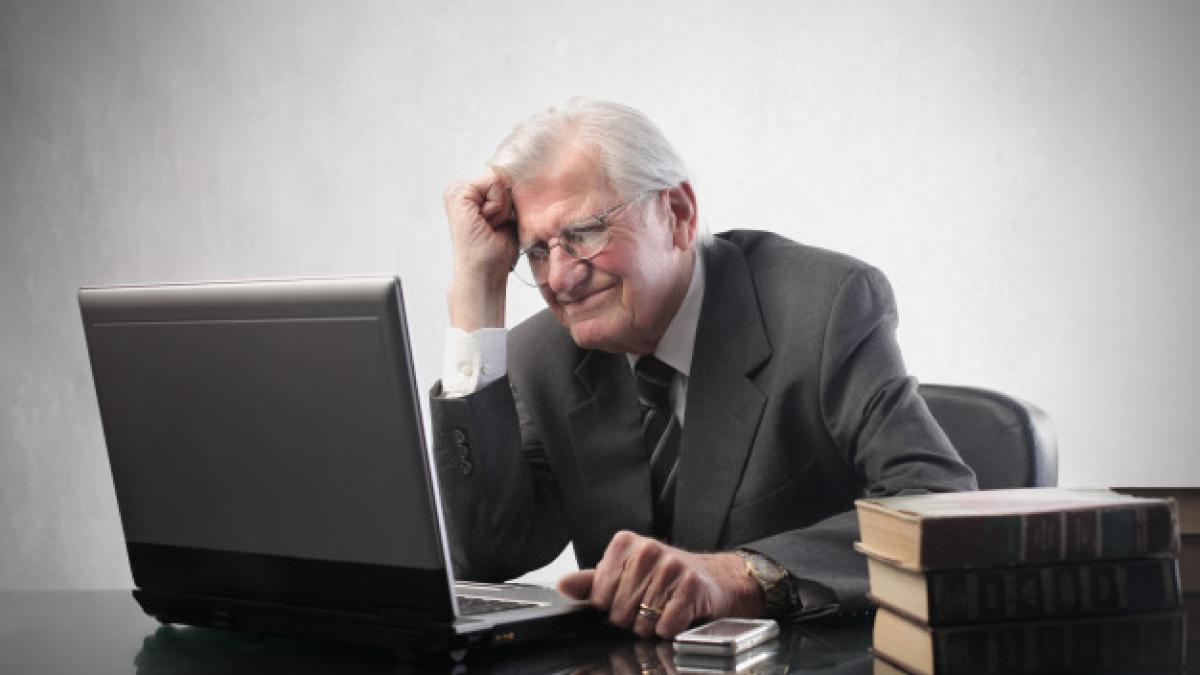 senior_businessman_working_laptop_102671_3985_97880300