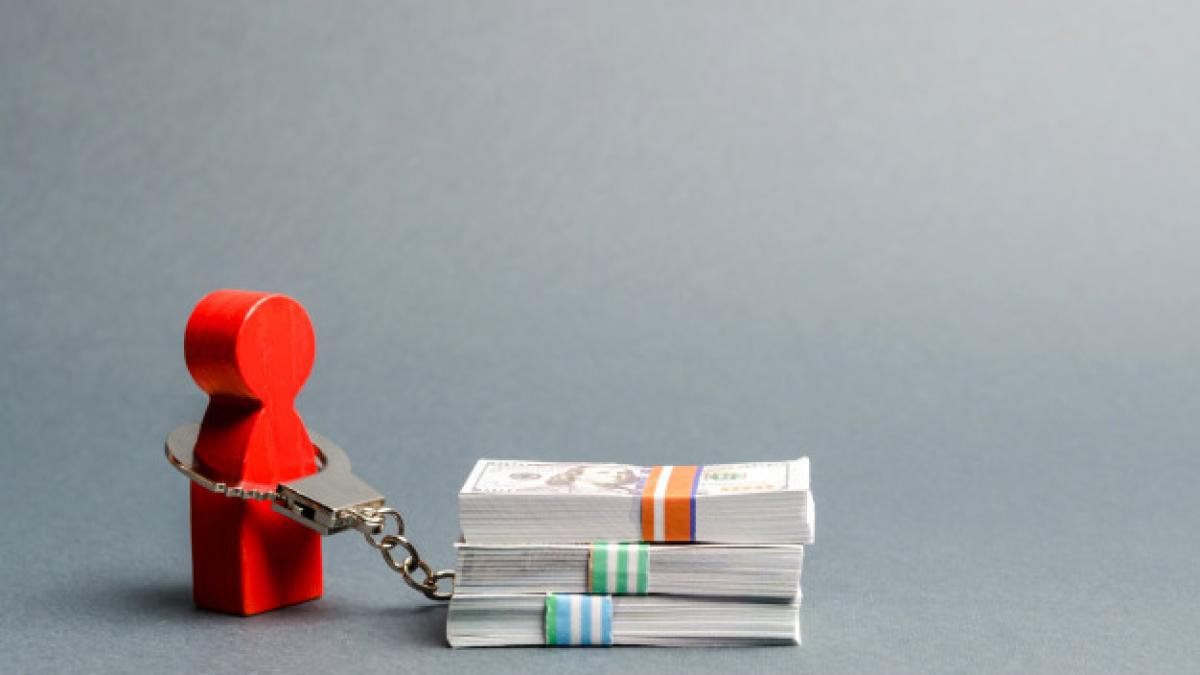 person_is_handcuffed_with_stack_money_man_is_addicted_money_shopaholic_72572_987_00207400