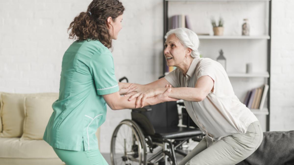 young_nurse_assisting_disabled_senior_woman_23_2147861477_84255700