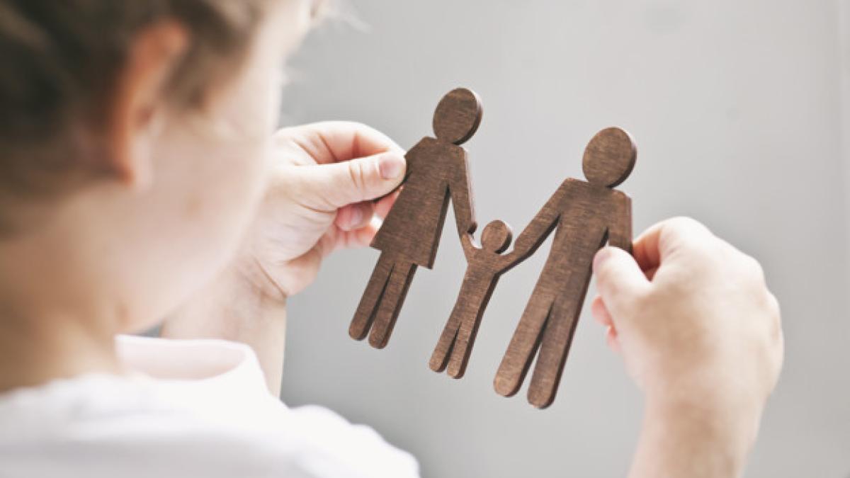 little_child_looking_wooden_figures_mom_dad_child_his_hands_concept_child_dreaming_about_family_244784_200_26835700