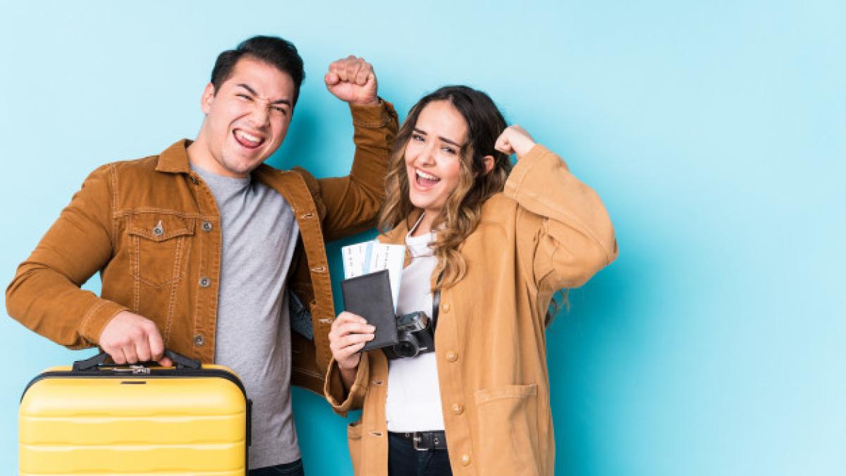 young_couple_ready_travel_isolated_raising_fist_after_victory_winner_concept_1187_58605_46908100