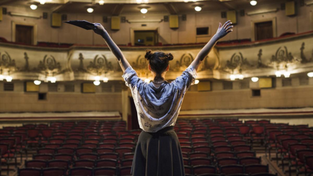 rear_view_female_mime_raising_her_arms_23_2147891793_56637200