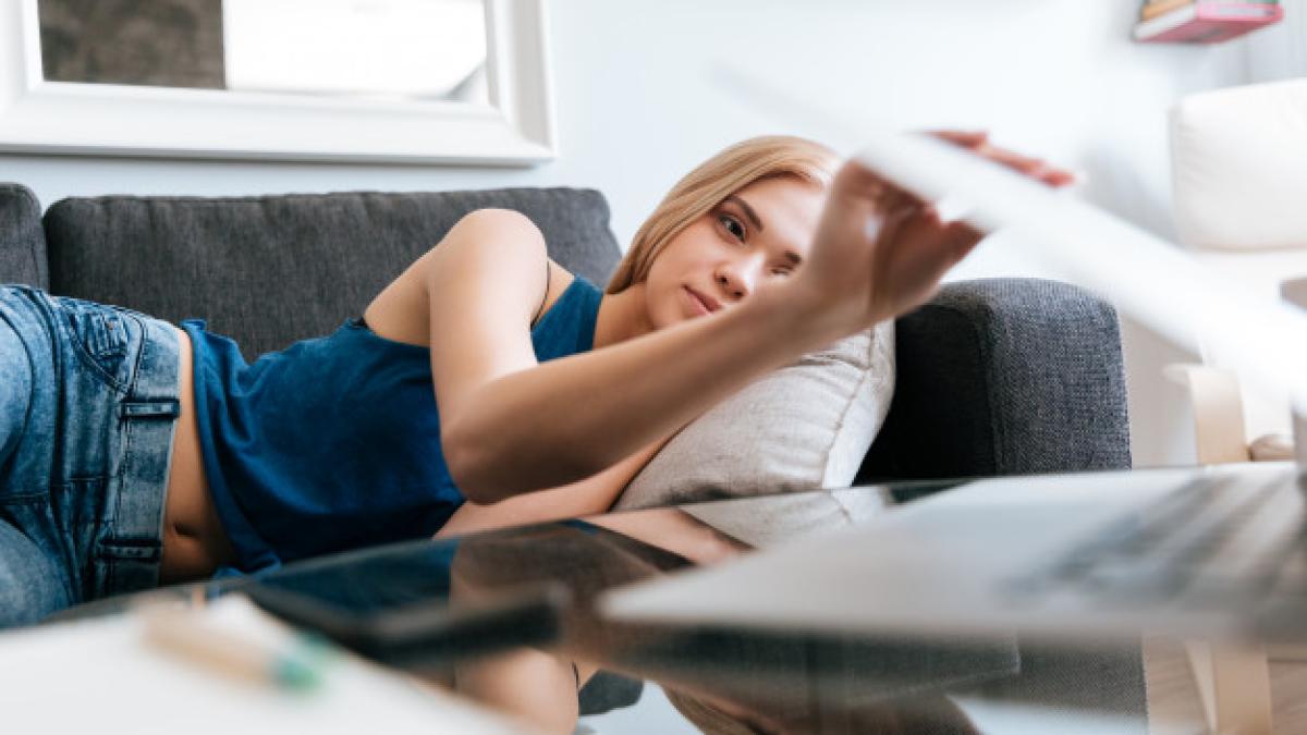 tired_woman_lying_sofa_closing_laptop_home_171337_19510_15574900