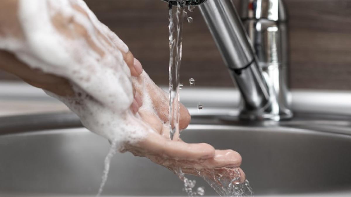 person_washing_hands_sink_close_up_23_2148685597_75831900