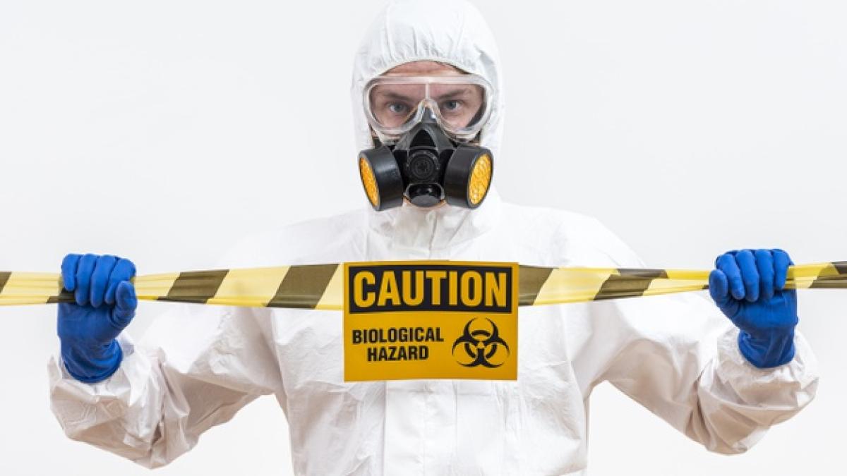 man_hazmat_suit_with_danger_sign_23_2148483231_05859900