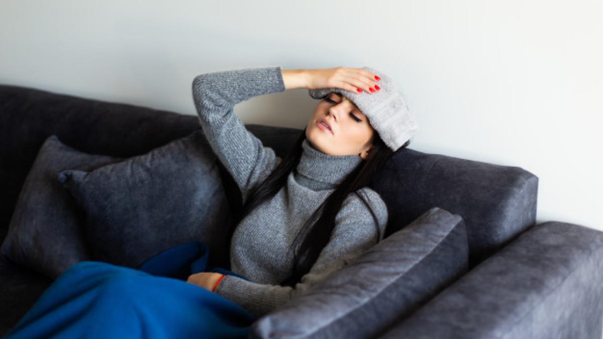 sick_young_woman_grey_homewear_sitting_bed_with_laptop_working_looking_thermometre_after_measuring_temperature_illness_freelance_concept_231208_1237_07576200
