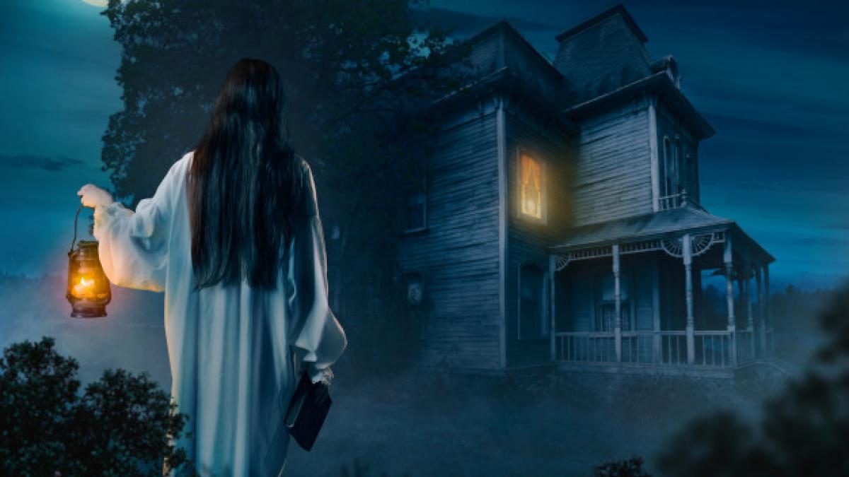 female_person_white_shirt_holds_kerosene_lamp_spellbook_hand_against_abondoned_house_moonlit_night_back_view_266732_1922_84409400