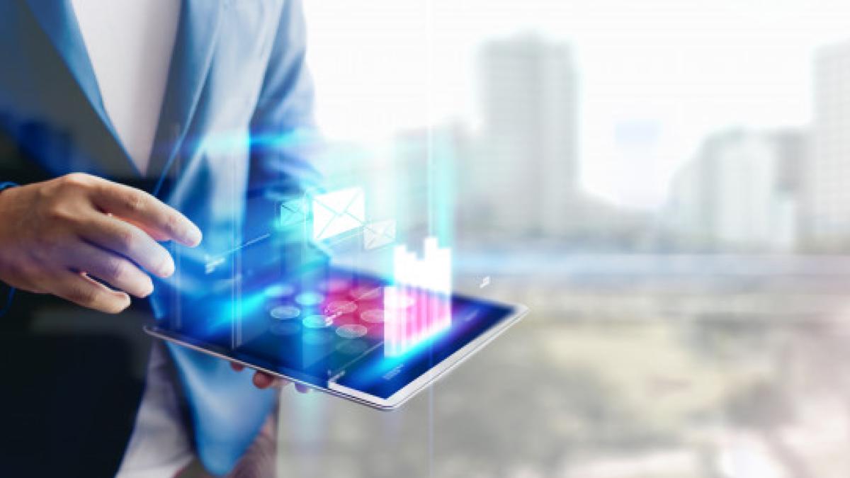 reflection_businessman_using_tablet_analyzing_data_economic_growth_graph_chart_copy_space_concept_tablet_with_hologram_44282_8_49804600