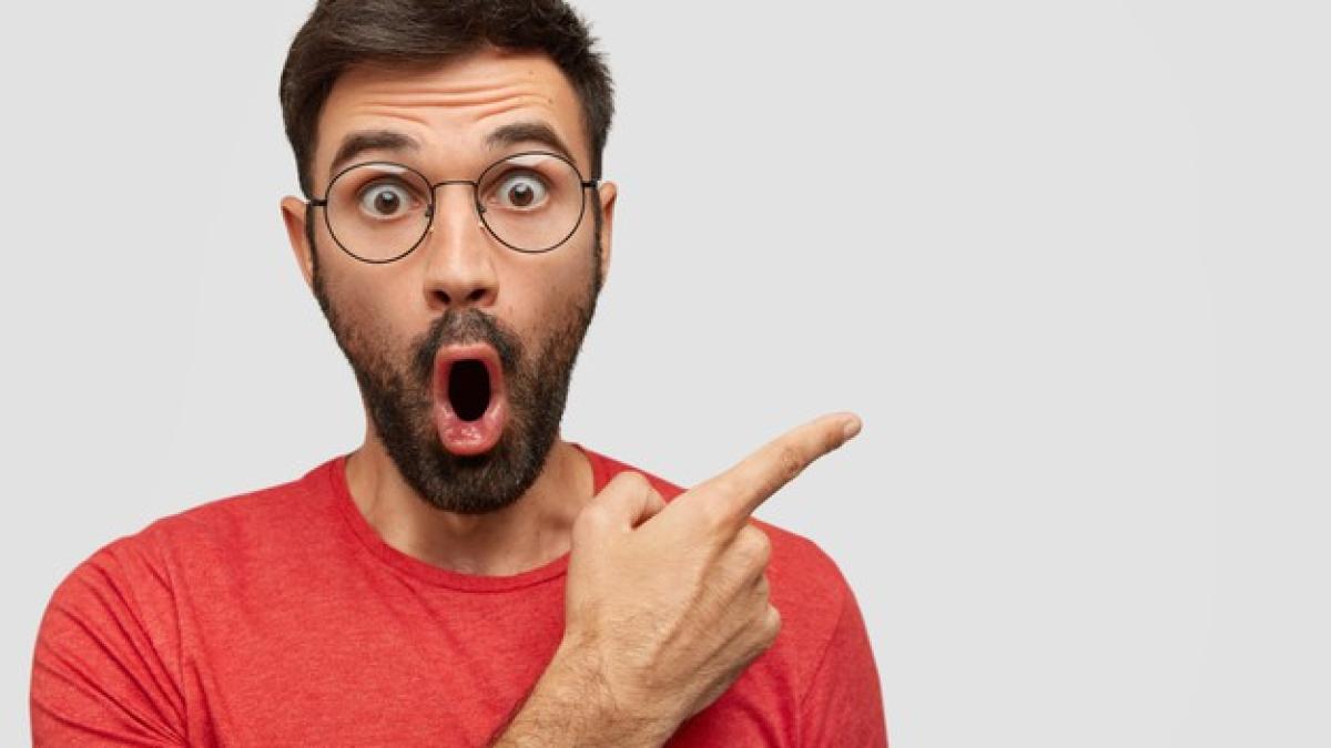 surprised_bearded_young_male_with_eyes_popped_out_has_astonished_expression_points_aside_blank_copy_space_273609_15492_71961900
