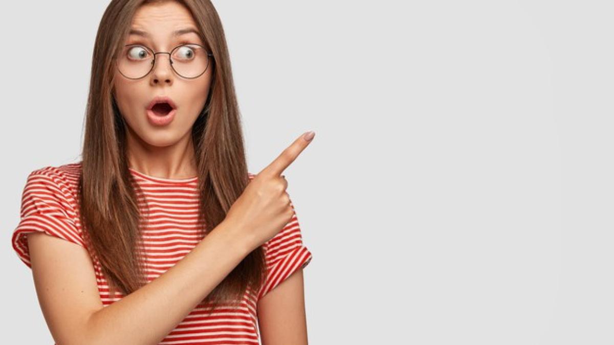 its_incredible_look_astonished_dark_haired_young_woman_being_amazed_by_what_is_near_her_273609_17612_26404900