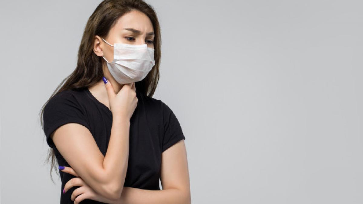 woman-wearing-black-t-shirt-medical-protective-mask-feeling-sick_179666-176_73604100