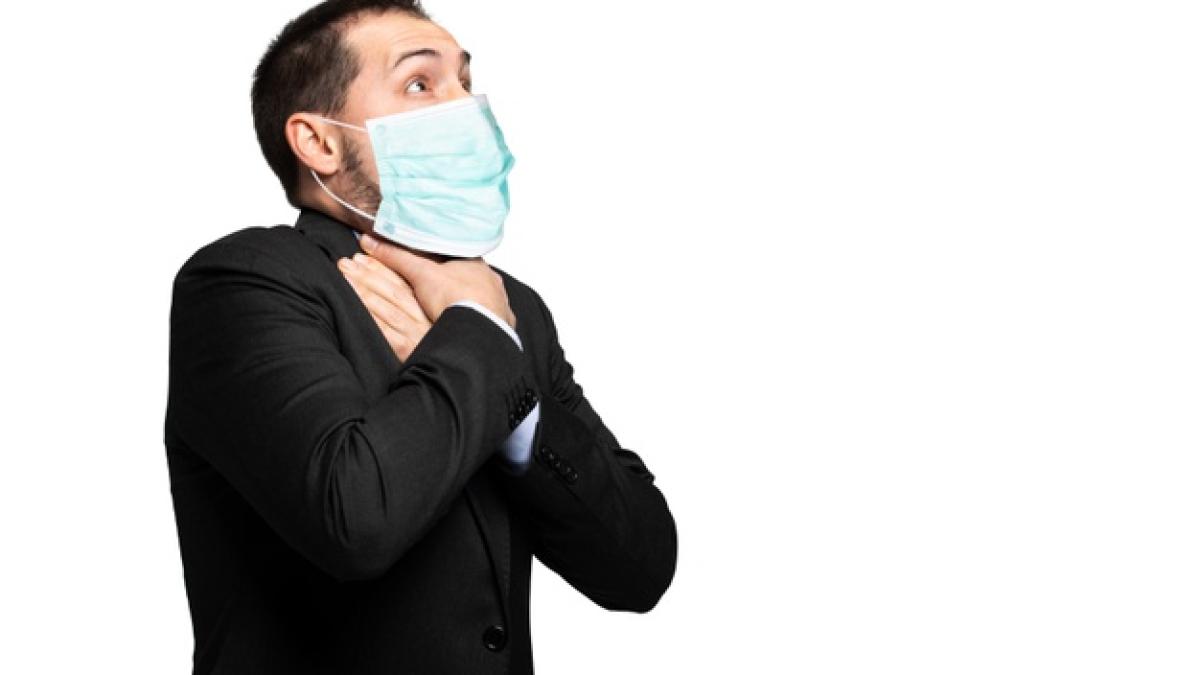 man-choking-due-lack-air-isolated-white-wearing-mask-coronavirus-concept_53419-9969_01883500