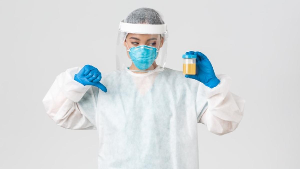 coronavirus-disease-healthcare-workers-concept-side-view-serious-tech-lab-employee-researcher-personal-protective-equipment-show-thumb-down-disapproval-bad-analyze-result_1258-17571_27630700