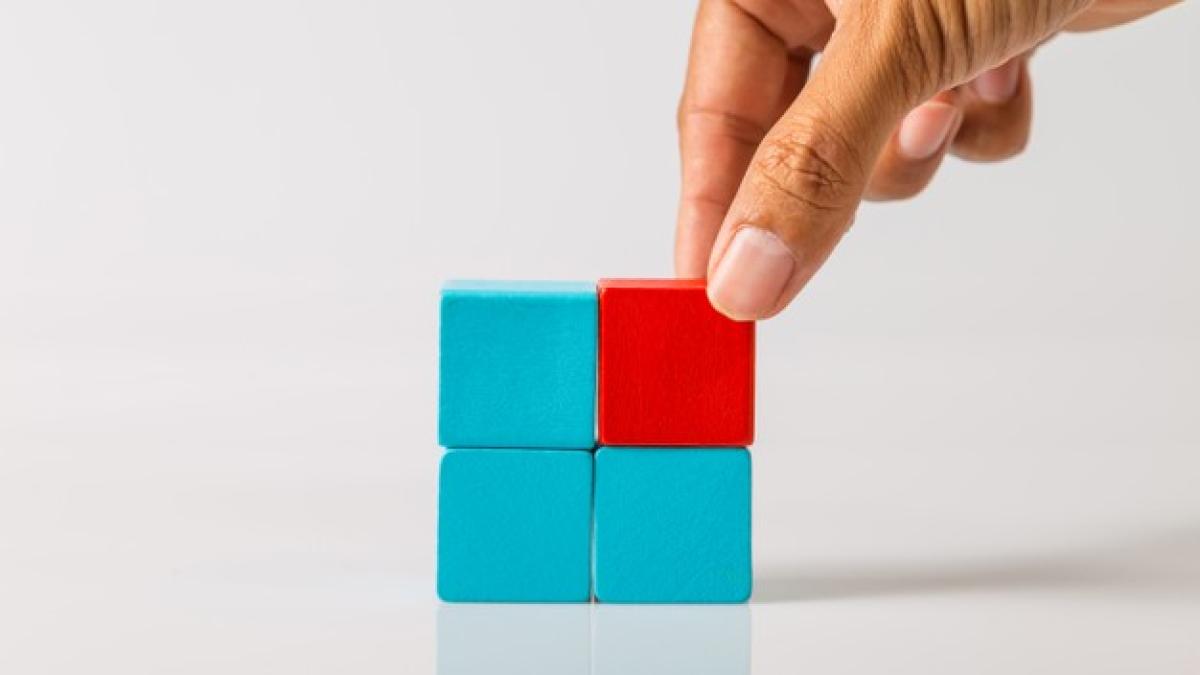 hand-adding-last-missing-wooden-block-into-place-business-success-concept_38810-8926_23697500