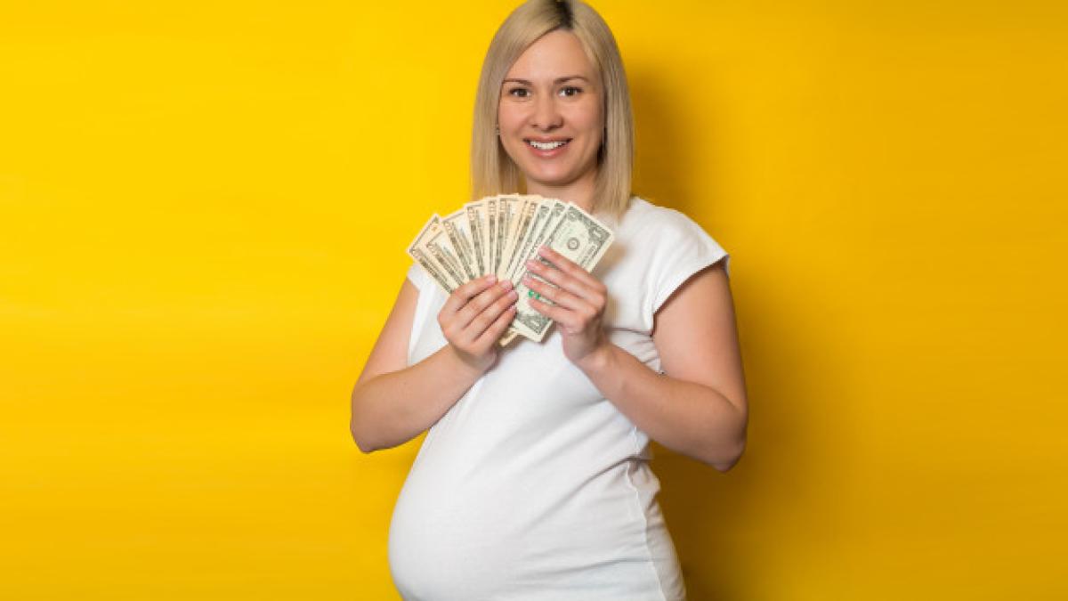 happy-pregnant-woman-with-money-dollars-yellow-wall-benefits-pregnant-women_107083-302_22826100