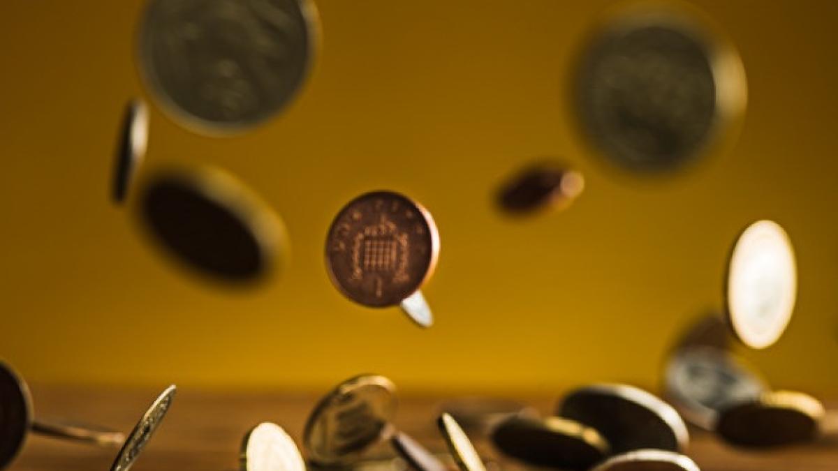 silver-golden-coins-falling-coins-wooden-wall_155003-7868_95889400