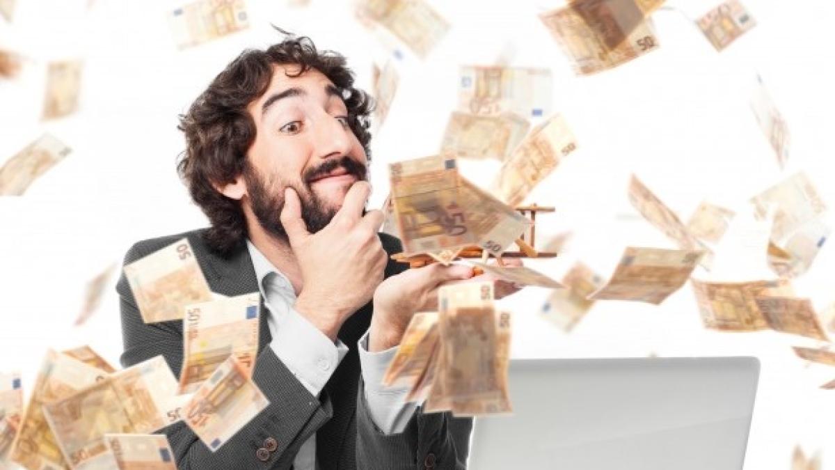 pensive-businessman-money-rain_1154-229_41089800