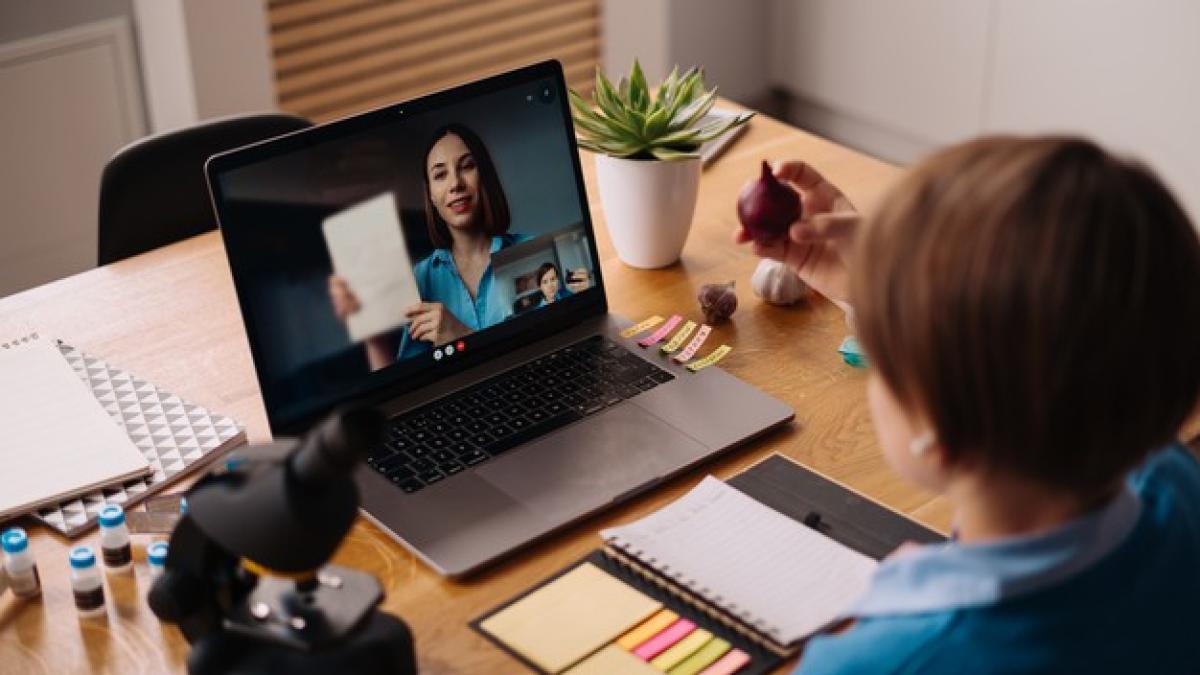 preteen-boy-uses-laptop-make-video-call-with-his-teacher_158595-7519_21219100