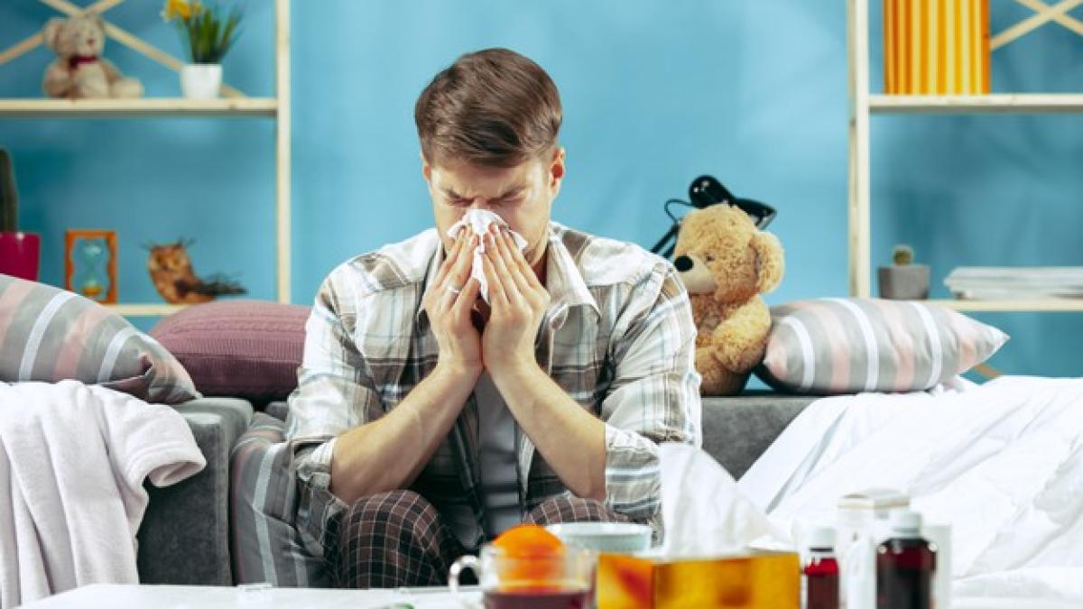 bearded-sick-man-with-flue-sitting-sofa-home-blowing-his-nose-winter-illness-influenza-pain-concept-relaxation-home-healthcare-concepts_155003-23249_33616000
