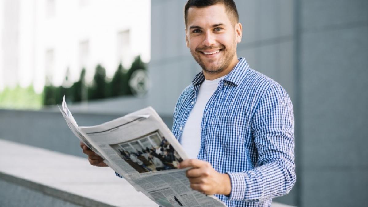 handsome-man-with-newspaper_23-2147694646_63747400