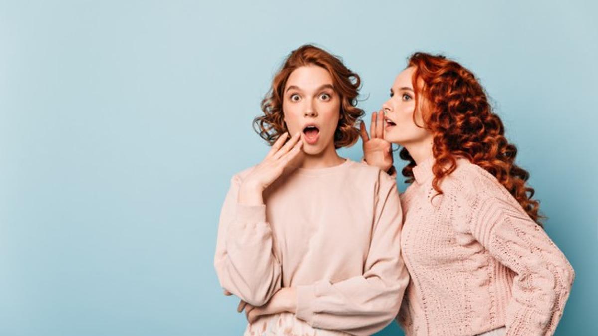 shocked-ladies-sharing-rumors-studio-shot-amazed-gossip-girls-posing-blue-background_197531-17349_44827300