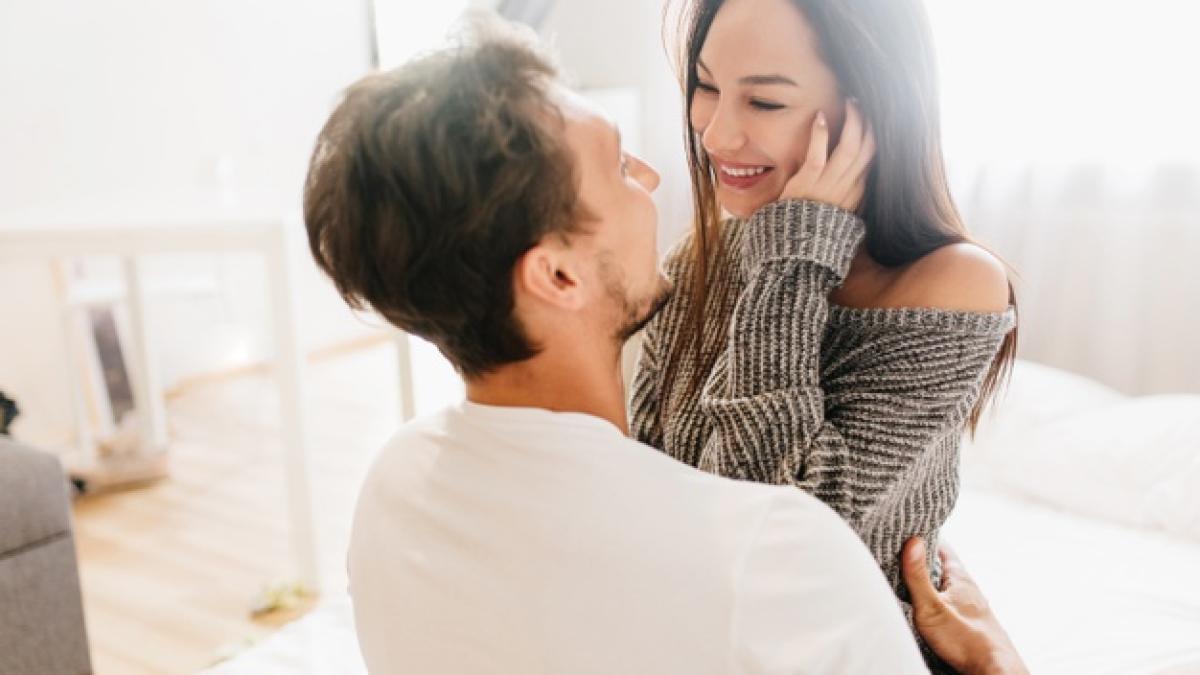 short-haired-happy-man-embracing-laughing-young-woman-gray-soft-clothes_197531-5625_12973800