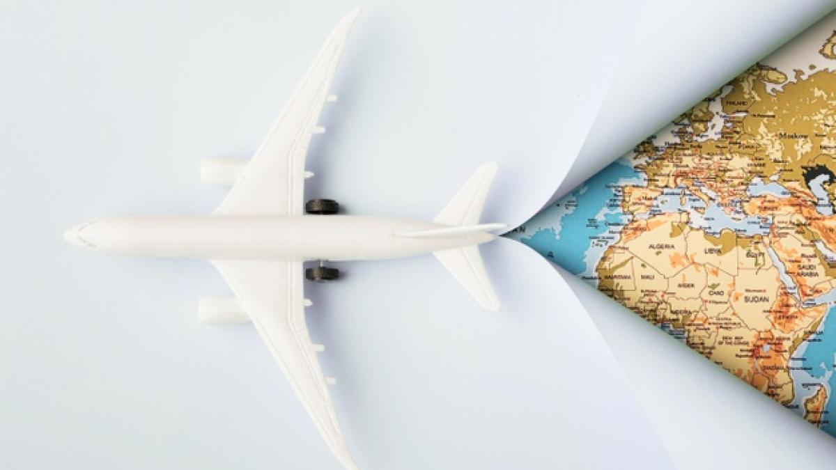 top-view-white-toy-plane-map_23-2148666303_89482500