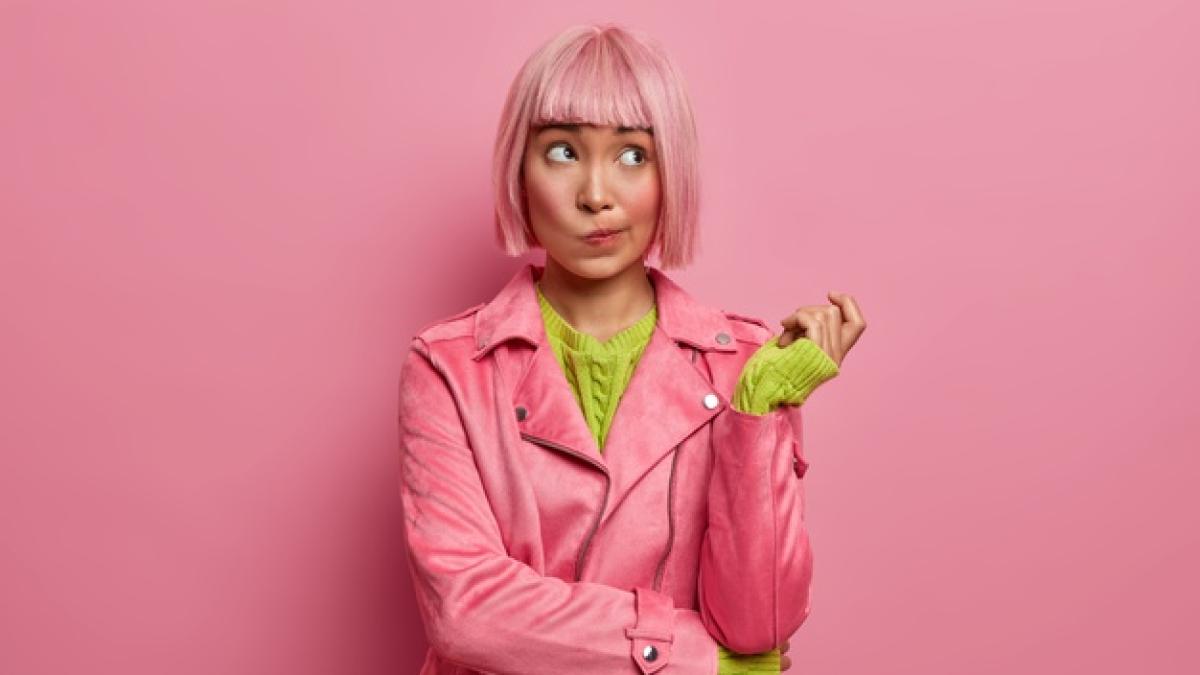 thoughtful-attractive-asian-female-looks-away-thinks-hesitant-purses-lips-raises-hand-tries-decide-how-waste-money-dyed-rosy-bob-hair_273609-42946_38943900