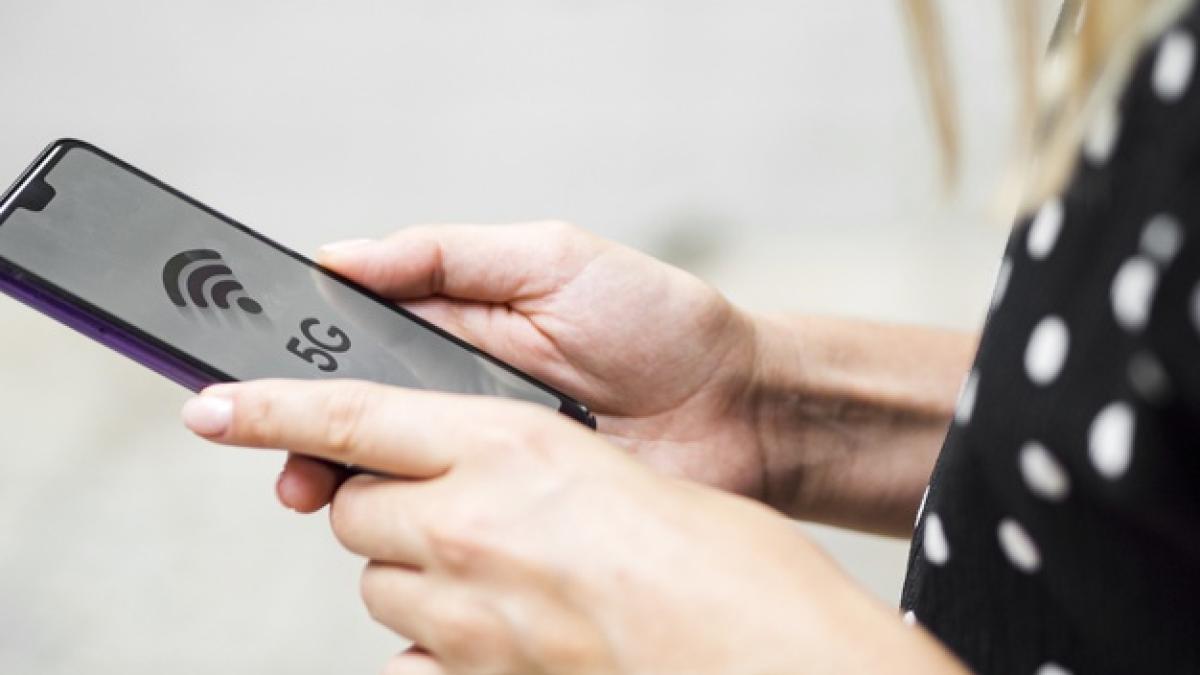 side-view-woman-holding-phone-hands_23-2148295836_74964900