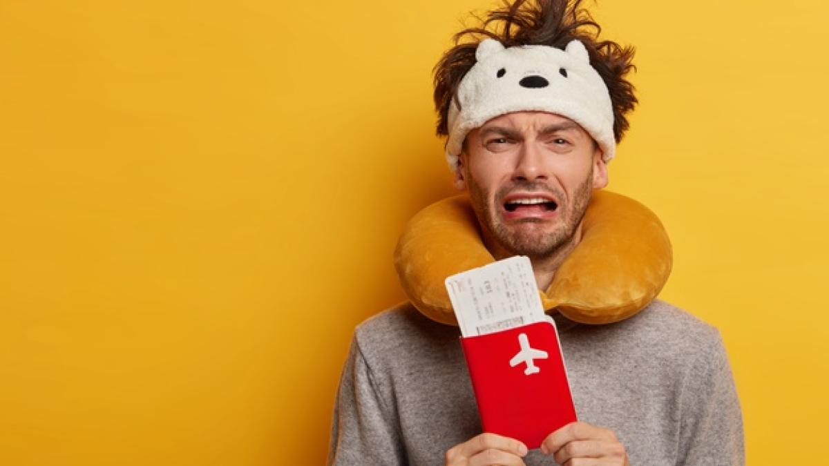 male-passenger-wearing-inflated-travel-pillow-neck-cute-eye-mask_273609-36743_26946200