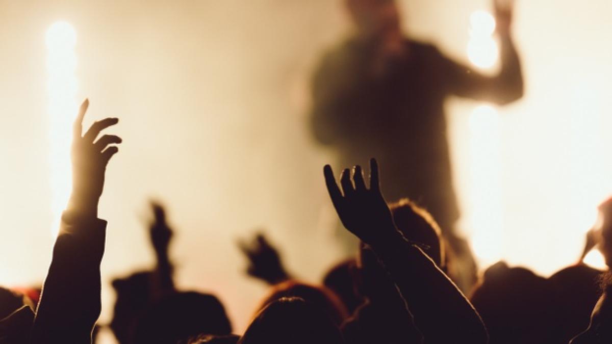 dancing-concert-while-singer-is-performing-surrounded-with-lights_181624-22022_75868100