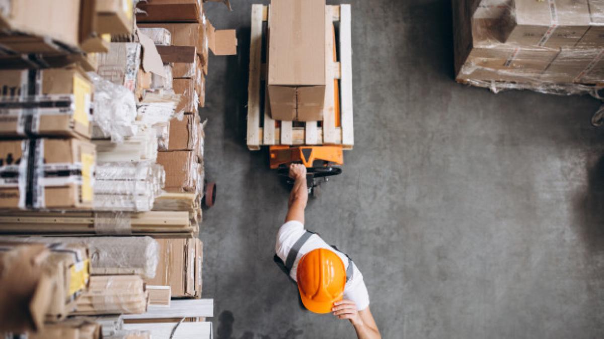 young-man-working-warehouse-with-boxes_1303-16617-1_24028600