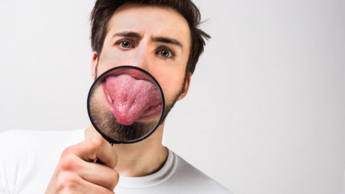 close_up_cut_view_guy_showing_his_tongue_through_loupe_he_is_trying_have_some_fun_be_boring_isolated_white_wall_152404_2413_19821800