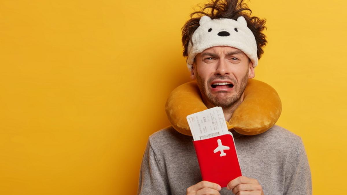 male-passenger-wearing-inflated-travel-pillow-neck-cute-eye-mask_resize_64665300