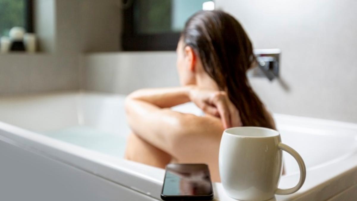 side-view-woman-bathtub-with-coffee-mug_23-2148271100_39744800